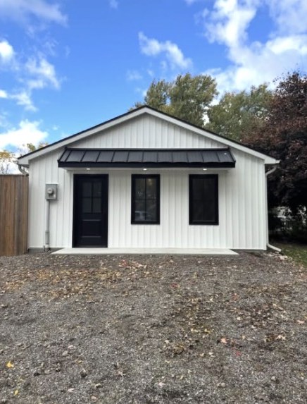 Renovated bungalow with metal roof entry